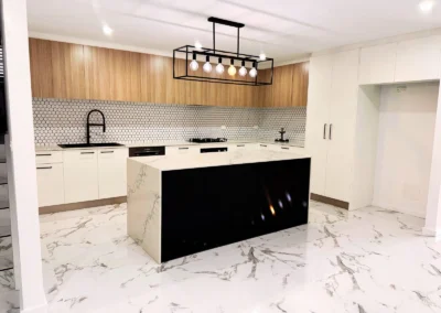 Modern kitchen with marble floor and island